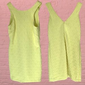 Lilly Pulitzer yellow mini dress with silver accent threading in the pattern.